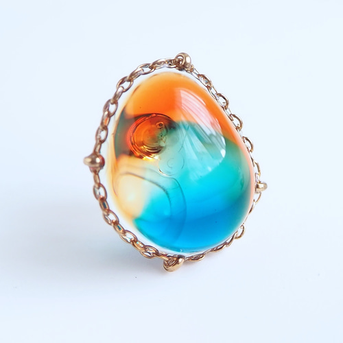 ブルーアンバーのような 宝石レジン] イヤリング/ピアス オレンジ 痛く