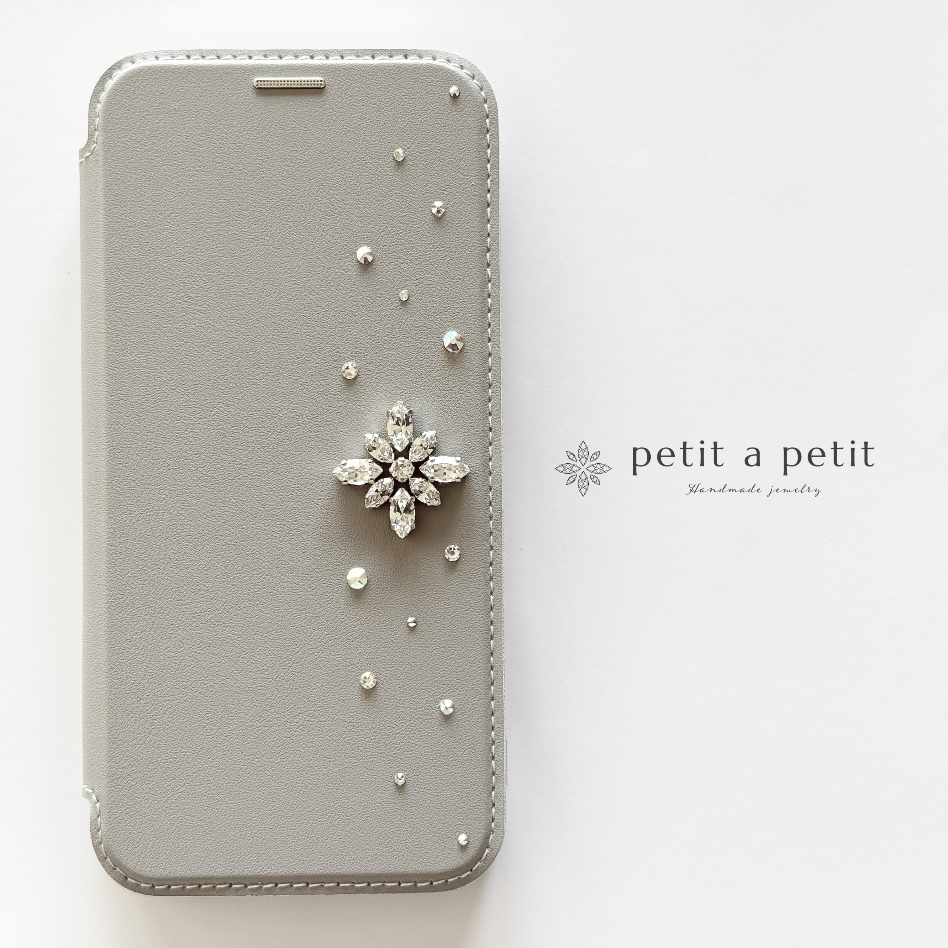 復刻 Many Thanks♡ スワロフスキー®︎ ビジューの手帳型スマホケース clématite ｜フォーマルにも