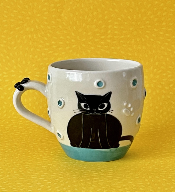 猫絵肉球マグ(両手を上げた黒猫・トルコブルー)『猫のマグカップ』 3枚目の画像