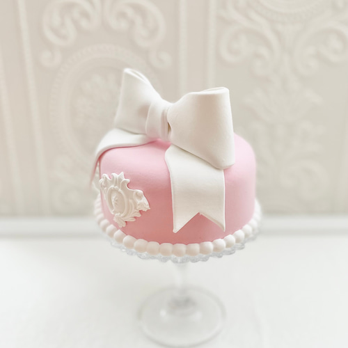 フェイクケーキ　クレイケーキ　リボンケーキ　誕生日 ラブリーリボンのクレイケーキ✳︎色変更可＊フェイクケーキ