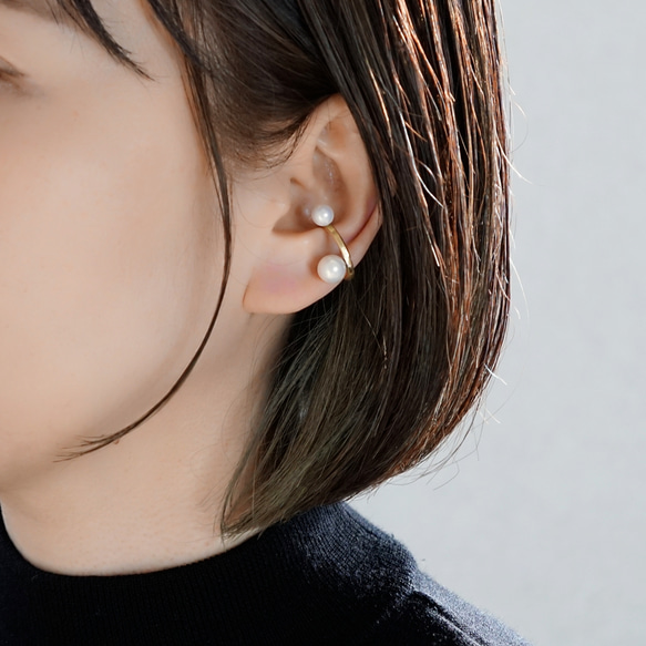 找到一枚鑲嵌珍珠的黃銅耳夾 第2張的照片