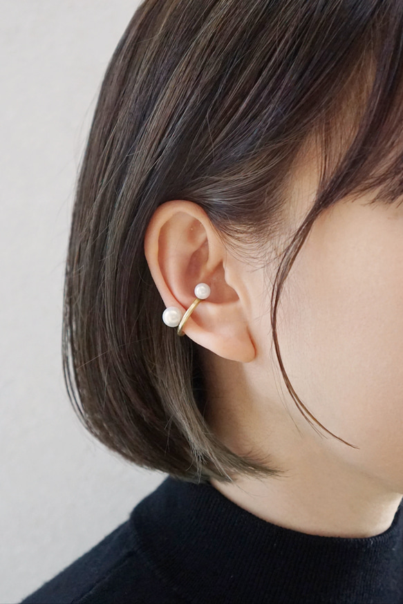 找到一枚鑲嵌珍珠的黃銅耳夾 第3張的照片