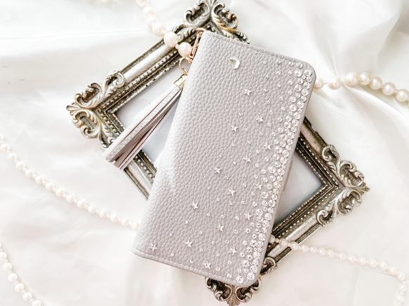 手帳型Phone15pro,14他 月 星クリスタル グレー スワロフスキーデコレーション ケース ニュアンスカラー                                     商品をご覧頂きありがとうございます。 Swarovski®︎ Crys L1229084906(9425円)