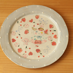 粉藍色圓點時尚貓和粉紅色 mofumo 蓬鬆輪輞板。 第1張的照片