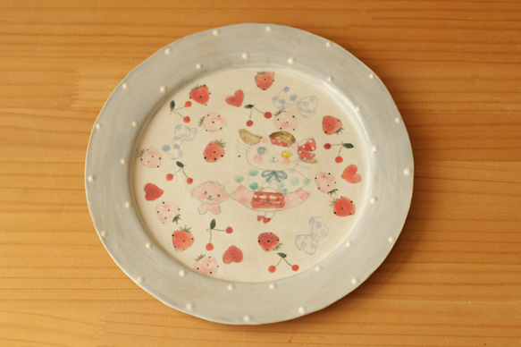 粉藍色圓點時尚貓和粉紅色 mofumo 蓬鬆輪輞板。 第1張的照片