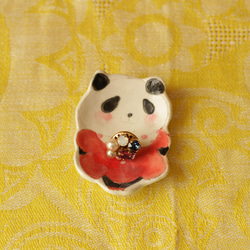 一個筷子架和豆瓣粉熊貓。 第3張的照片