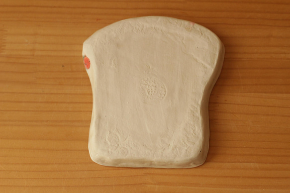 * 翻譯螞蟻產品粉桿舞熊貓麵包盤。 第5張的照片