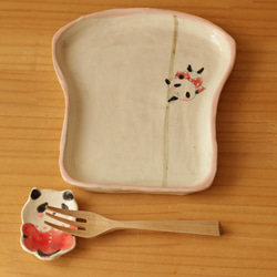 * 翻譯螞蟻產品粉桿舞熊貓麵包盤。 第6張的照片