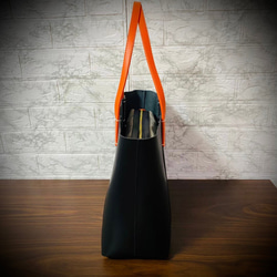 義大利真皮手提包，男女通用，時尚輕便，採用真牛皮製成，黑色，商務風格 第6張的照片