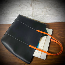 義大利真皮手提包，男女通用，時尚輕便，採用真牛皮製成，黑色，商務風格 第4張的照片