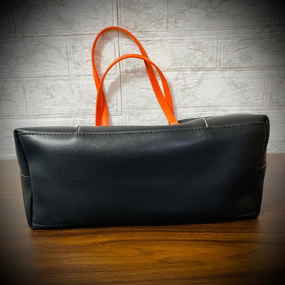 義大利真皮手提包，男女通用，時尚輕便，採用真牛皮製成，黑色，商務風格 第5張的照片