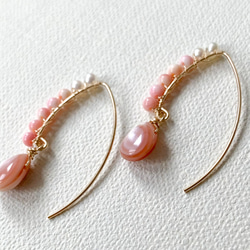 14kgf*粉紅貝殼淡水珍珠櫻桃欖尖形耳環*天然石材 第5張的照片