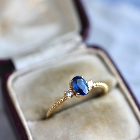 ブルーサファイア 0.54ct オーバルカット 4本爪×ドットアーム K18YG 