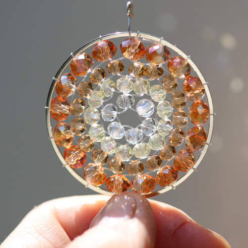 お引越し祝いに。オレンジの光の曼荼羅サンキャッチャー サン