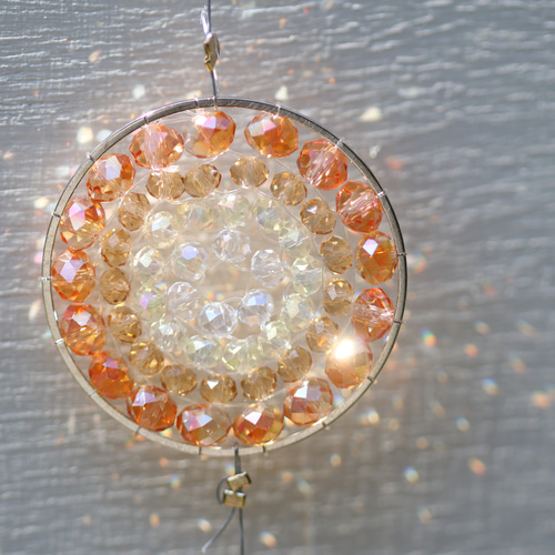 お引越し祝いに。オレンジの光の曼荼羅サンキャッチャー サン