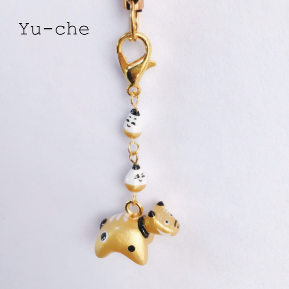 金べこ＆起き上がり小法師ストラップ 1枚目の画像