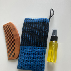 つばき油と桃ノ木のくしと手織りのケースのセット 1枚目の画像