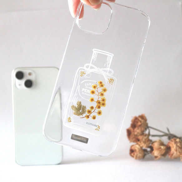 香水瓶に入ったミモザiPhoneケース｜ミモザとゴールドを合わせた