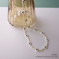 yellow * white flower 白い花のビーズネックレス　ビーズアクセサリー　フラワー　淡色　透明感　クリア 5枚目の画像