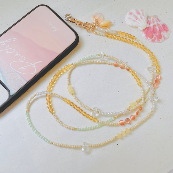 〖 phone strap 〗取り外しチャームset  スマートフォンストラップ(イエローベース)② 1枚目の画像