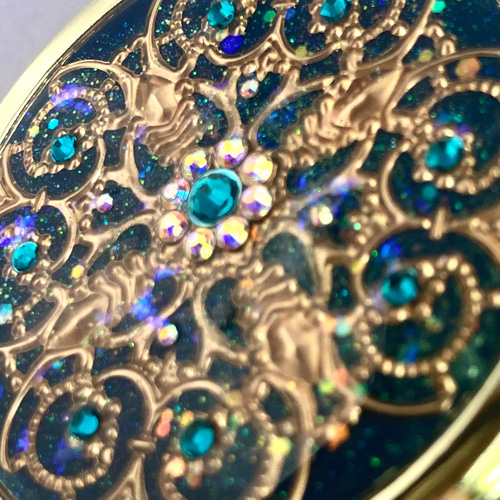 透かしパーツの鏡付きピルケースCROSS deep turquoise green