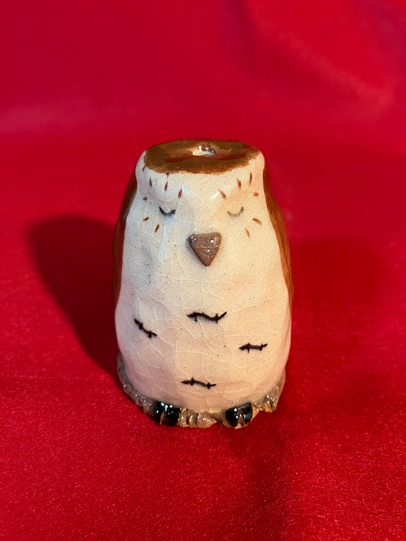 ほーほー鳴るミミズク笛人形ねんね 1枚目の画像
