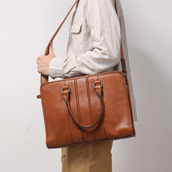 ④COACH ビジネスバッグ ブラウン 保存袋付き　ほぼ新品 ショルダー付き ボストンバッグ ビジネスバッグ 防水 本革 ブランデー