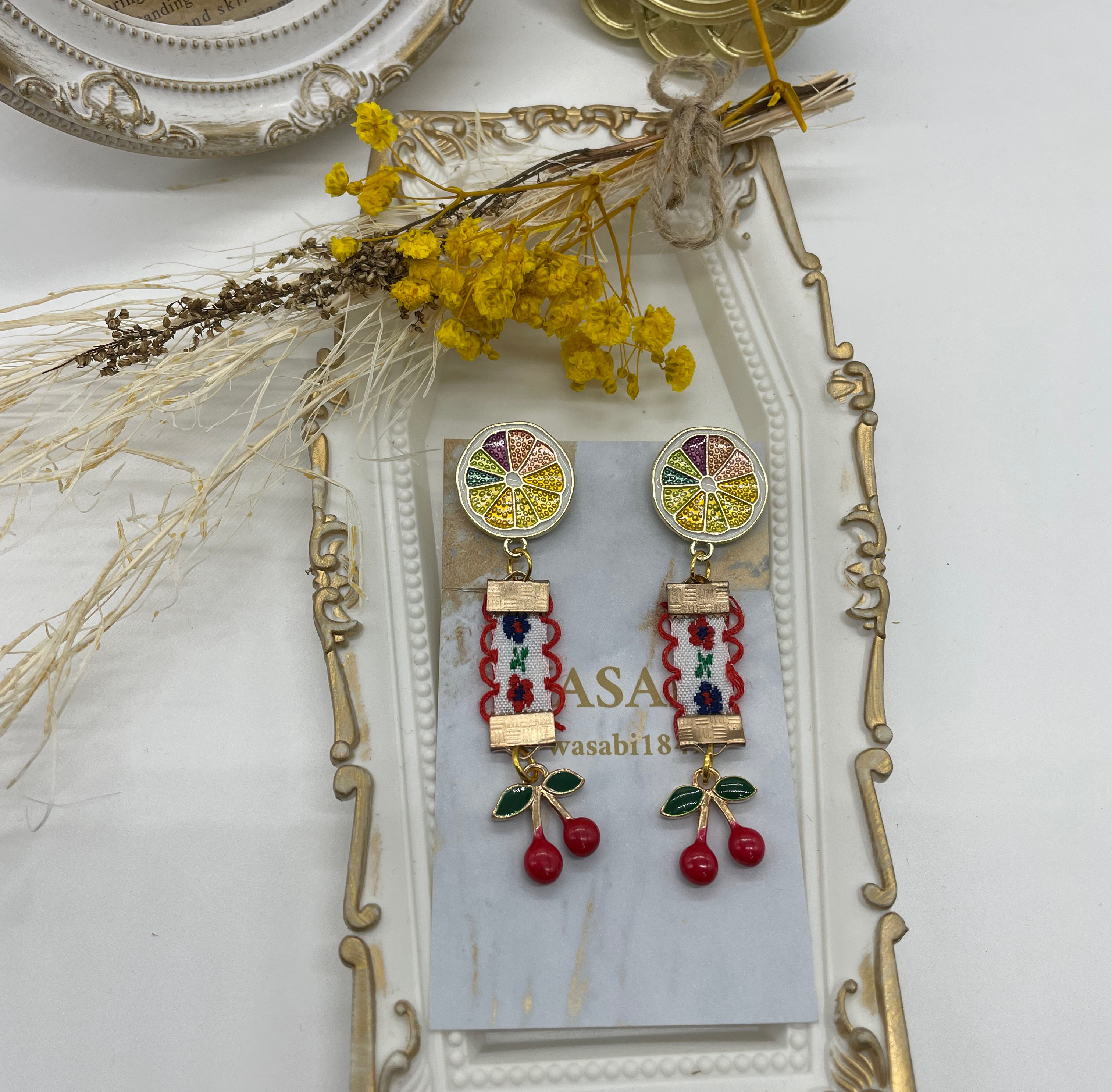 ライムカボションとかわいいお花リボンとチェリーのイヤリング