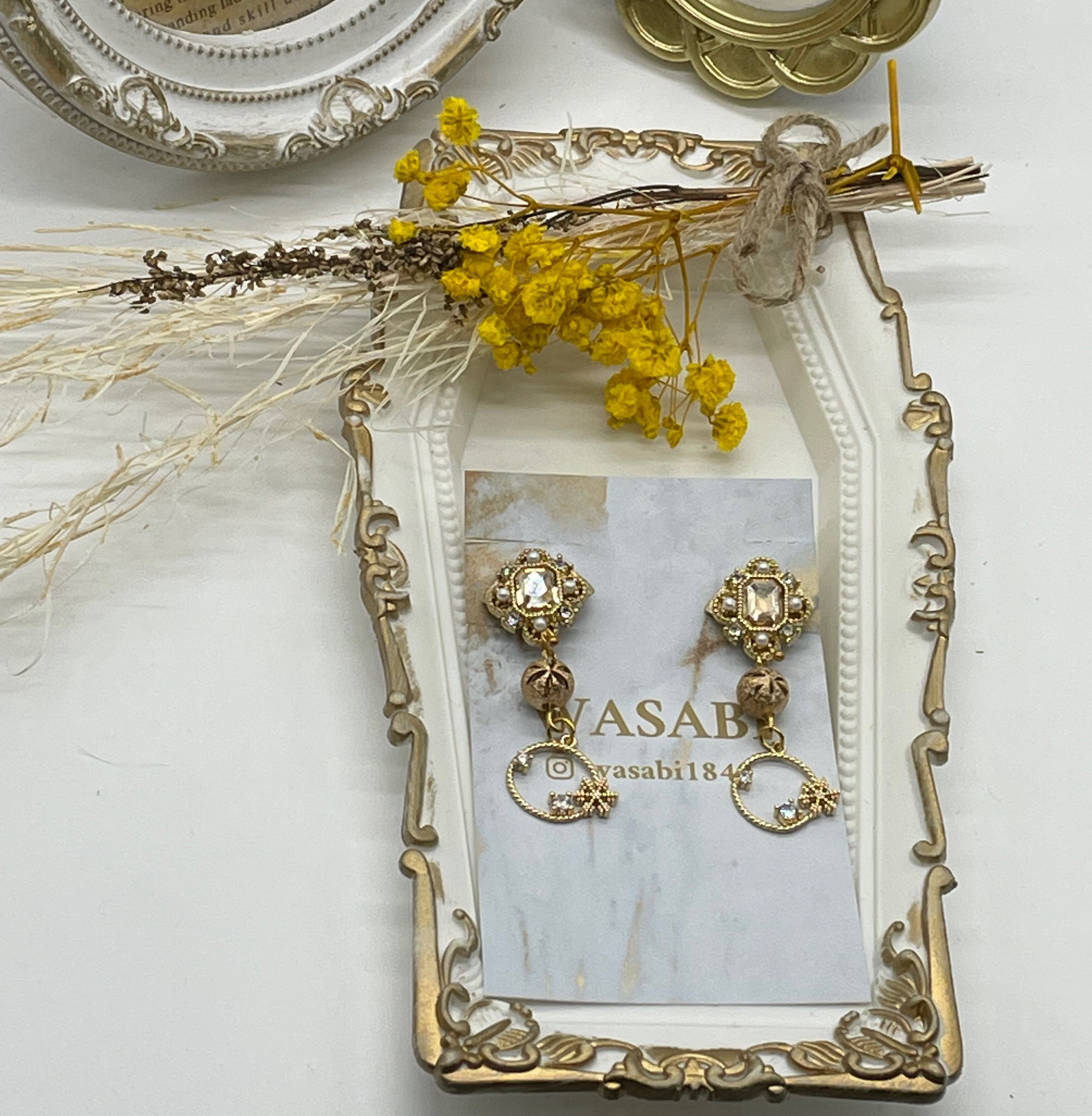 キラキラ雪の結晶のイエローラインストーンのイヤリング