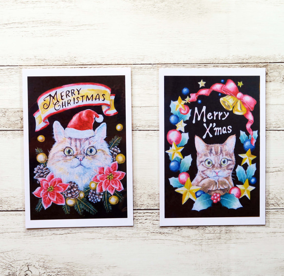 クリスマスにゃんこポストカード２枚組　キラキラリースに囲まれた猫ちゃんとサンタ帽を被ったもふもふ猫ちゃんのセット 1枚目の画像