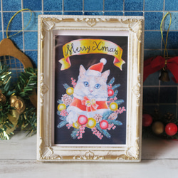 A4ポスター 〈クリスマスの猫天使〉ヨーロッパの街並みの上空を、人々