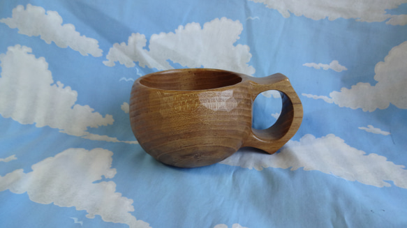 スマイルマークが浮かぶ　茶色い真桑の一木彫りコーヒーカップ　 5枚目の画像