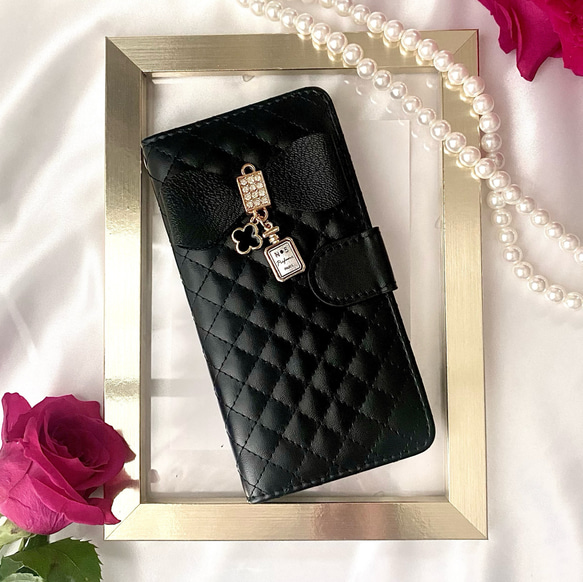 【特集掲載作品】iPhoneケース　スマホケース　リボン☆黒☆手帳型スマホケース　人気　カード収納　13　15　16 1枚目の画像