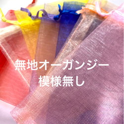 118〜結晶の形をして、オレンジ色のひし形の周りにクリスタルダイヤと，墨色の珠をつけたブローチA 12枚目の画像