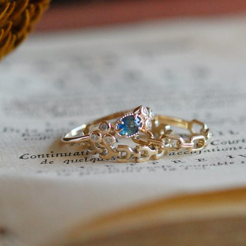 ete K10YG サファイア リング バイカラーサファイア 0.24ct マーキスカット K10YG リング