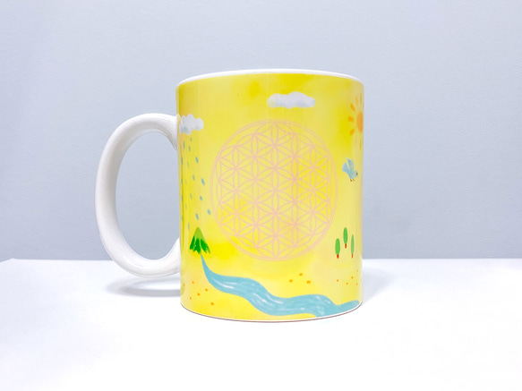 フラワーオブライフのマグカップ(黄） 1枚目の画像