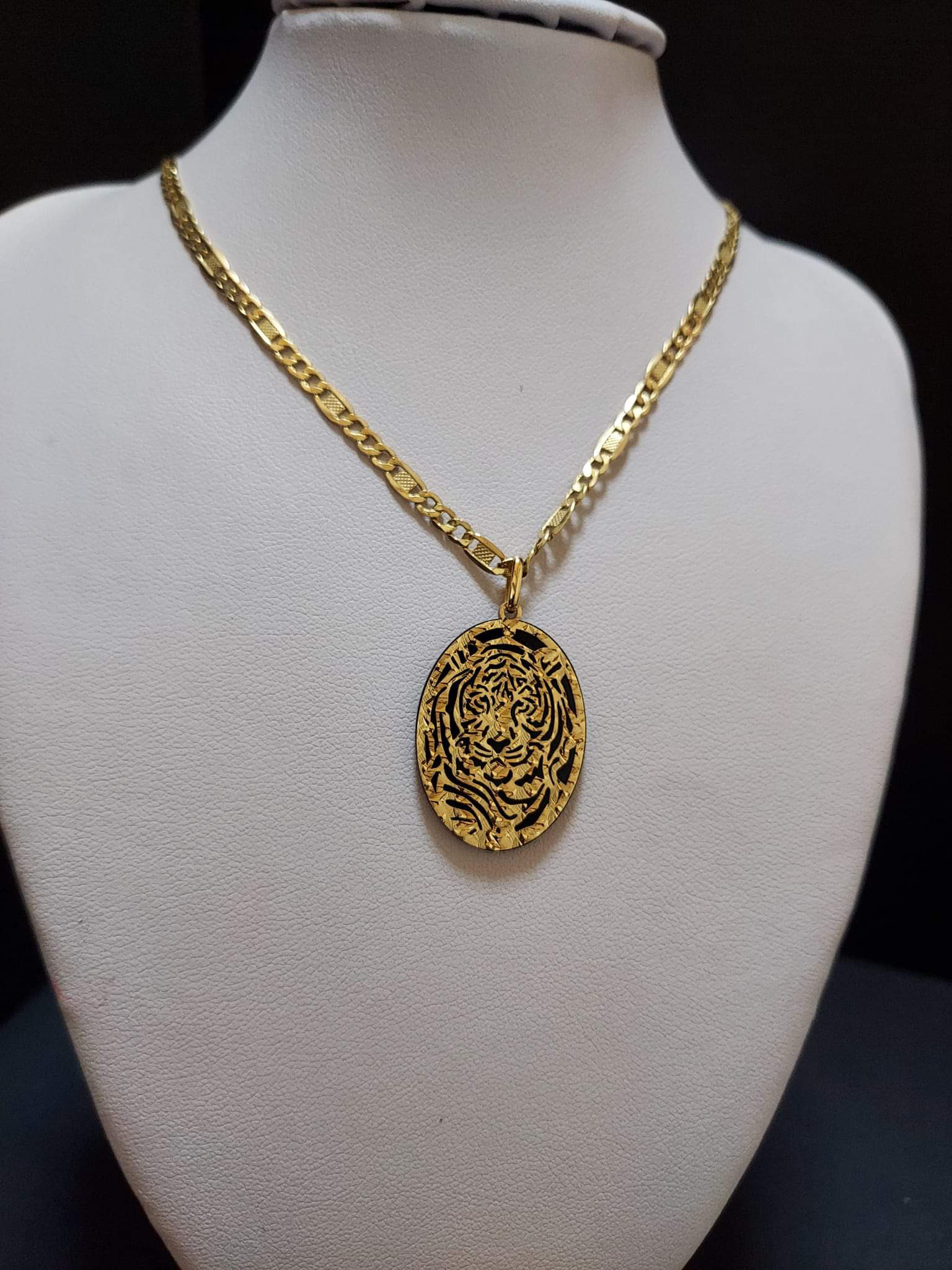 It's an Onyx with 18k Gold molded design.