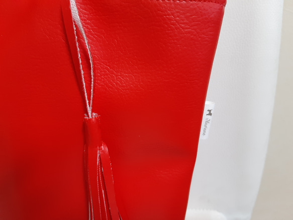合皮　　おしぶ様専用  裏地は赤と白のチェックです。 3枚目の画像