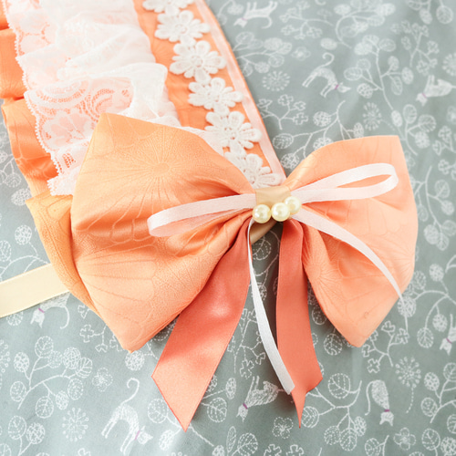 オレンジのボンネット風ヘッドアクセサリー