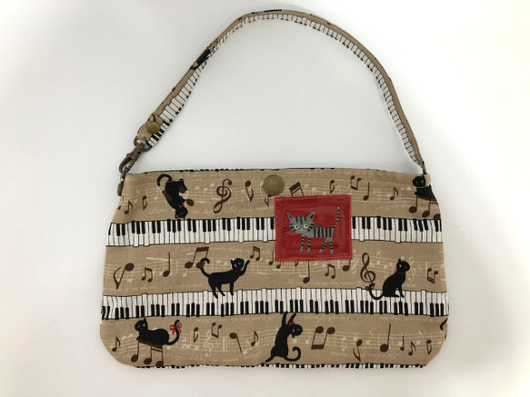 店舗展示品につきSALE　ピアノ猫　ぺたんこポーチ　２２×１３ｃｍ 1枚目の画像