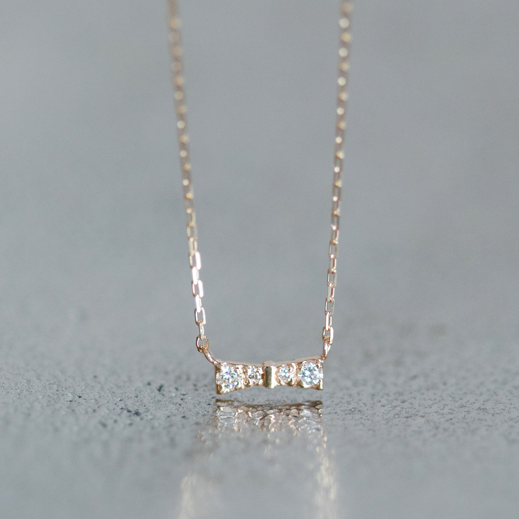 イエローゴールド 可愛いリボンデザイン ダイヤモンドネックレス スキンジュエリー K10/K18　01-05