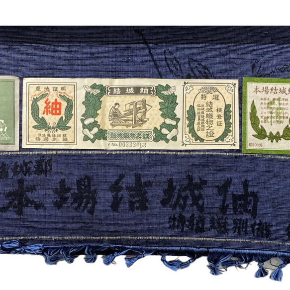 結城紬お召草花藍色と焦茶の紬でお作りしました大人の兵児帯・袋帯です．袋帯用軽い帯芯を使用しております． 6枚目の画像