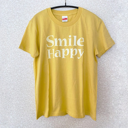 ロゴTシャツ Smile Happy マスタード　レディース　プリントTシャツ　黄色 1枚目の画像