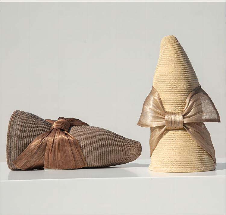 折りたたみサイザル麻麦わら帽子ラウンドトップ広いひさしファッショナブルで汎用性の高い女性の蝶結びソリッドカラーヘップバー