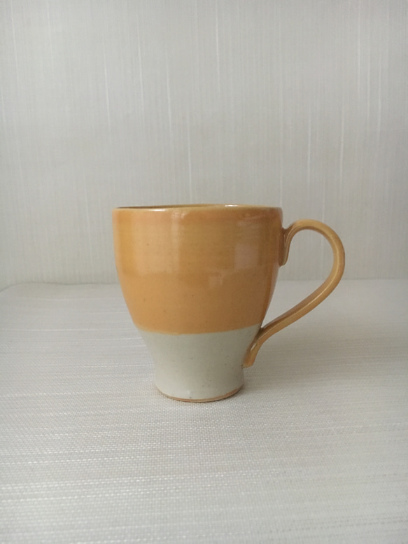オレンジ釉カップ 1枚目の画像