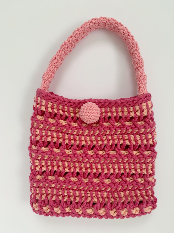 ピンクのアフガン編み模様ニットバッグ 1枚目の画像