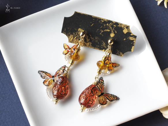 耳飾り アッサムの雫とオレンジ蝶々 ミューラー型擬態 〈 イヤリング , ピアス 〉 1枚目の画像