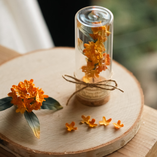 オレンジの花を閉じ込めた ペンダントトップ つぶやき
