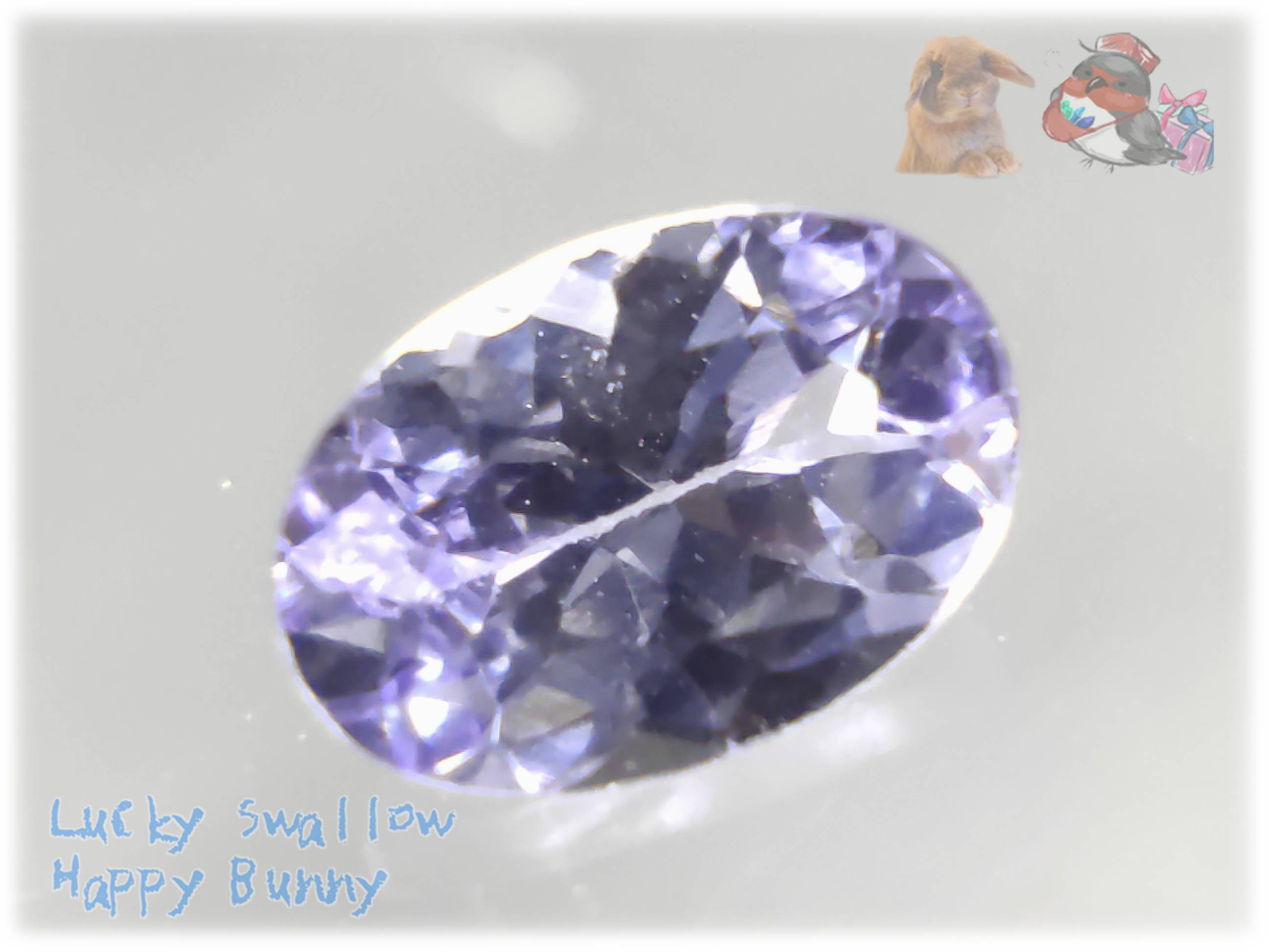 ゾイサイト タンザニア産 約 6.1 x 4.0 mm　0.55cts　自然光+レフ版　ピンクパープル　5792