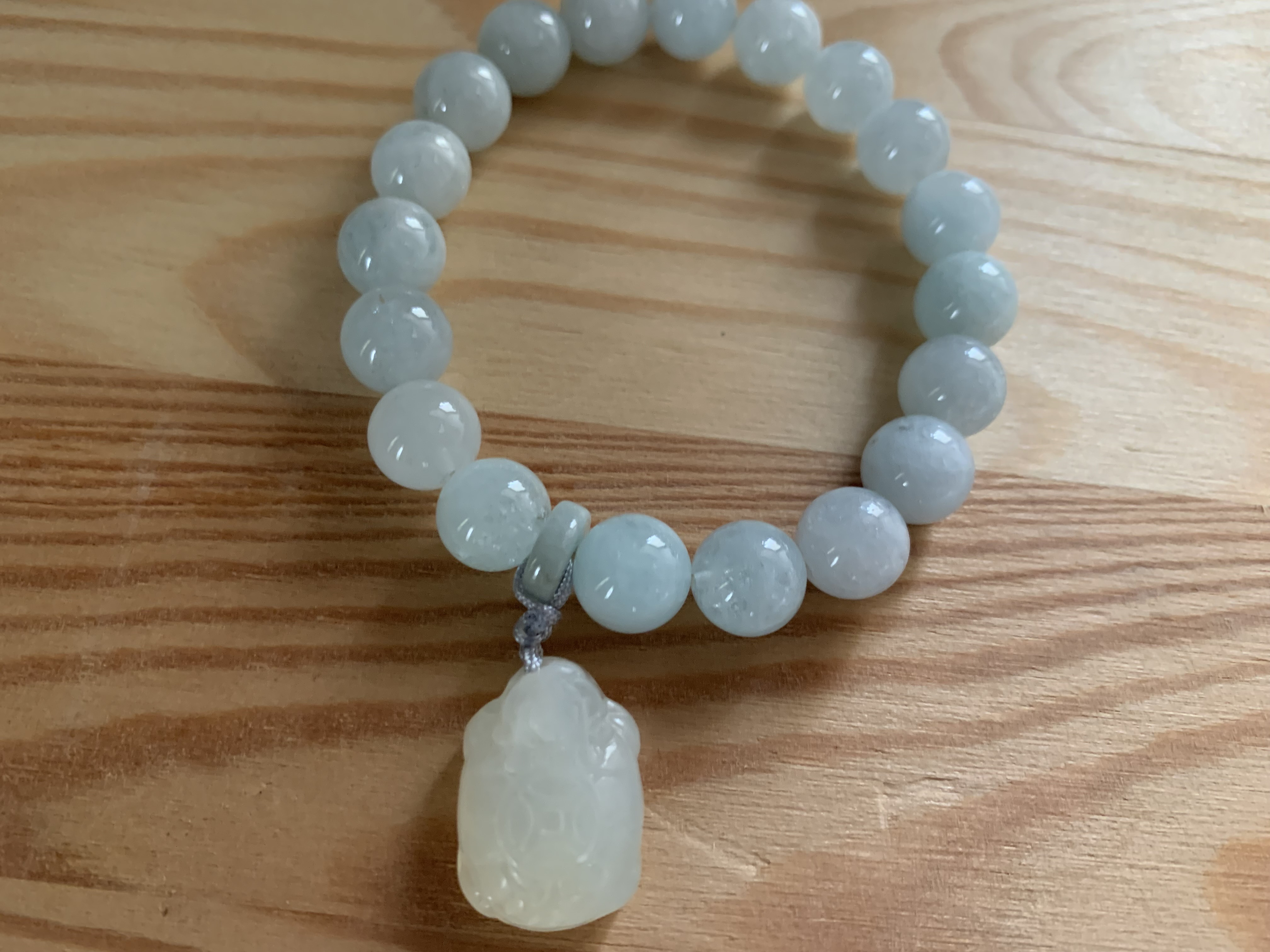 白玉龍亀彫り珠チャーム付き アクアマリンブレスレット